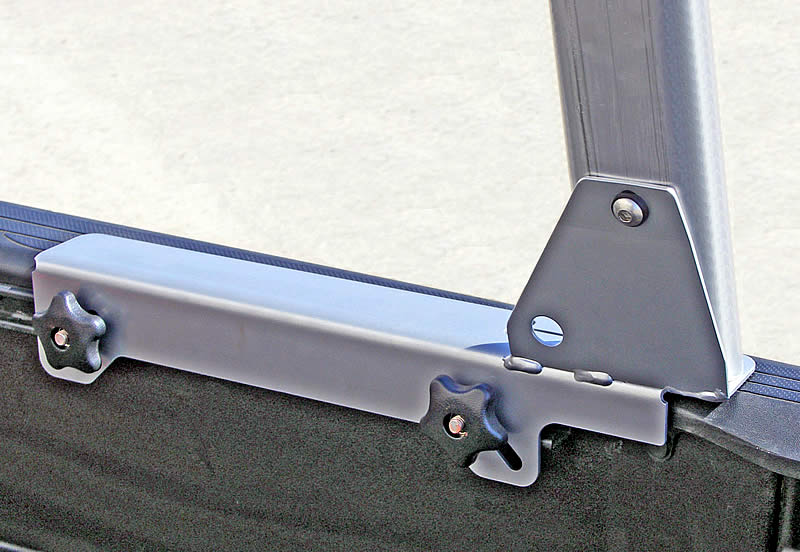 Track attachment for trucks with cargo management track rails in their beds